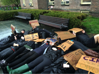 “Human Oil Spill” demonstration by members of the Vassar College Fossil Fuel Divestment Campaign.  Photo Credit: https://pbs.twimg.com/media/BmfIlWAIUAAeAly.jpg:large